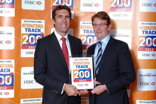 Captain Rob Clarke CTC Aviation Group Executive Director on left accepts Sunday Times award 19 Spt 2012.